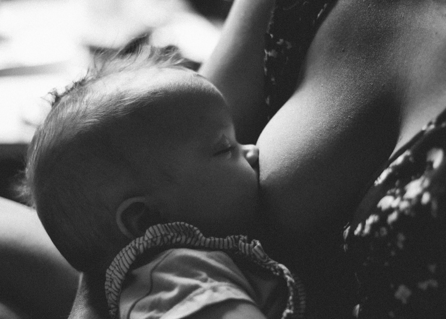 Close-up of a mother breastfeeding her baby